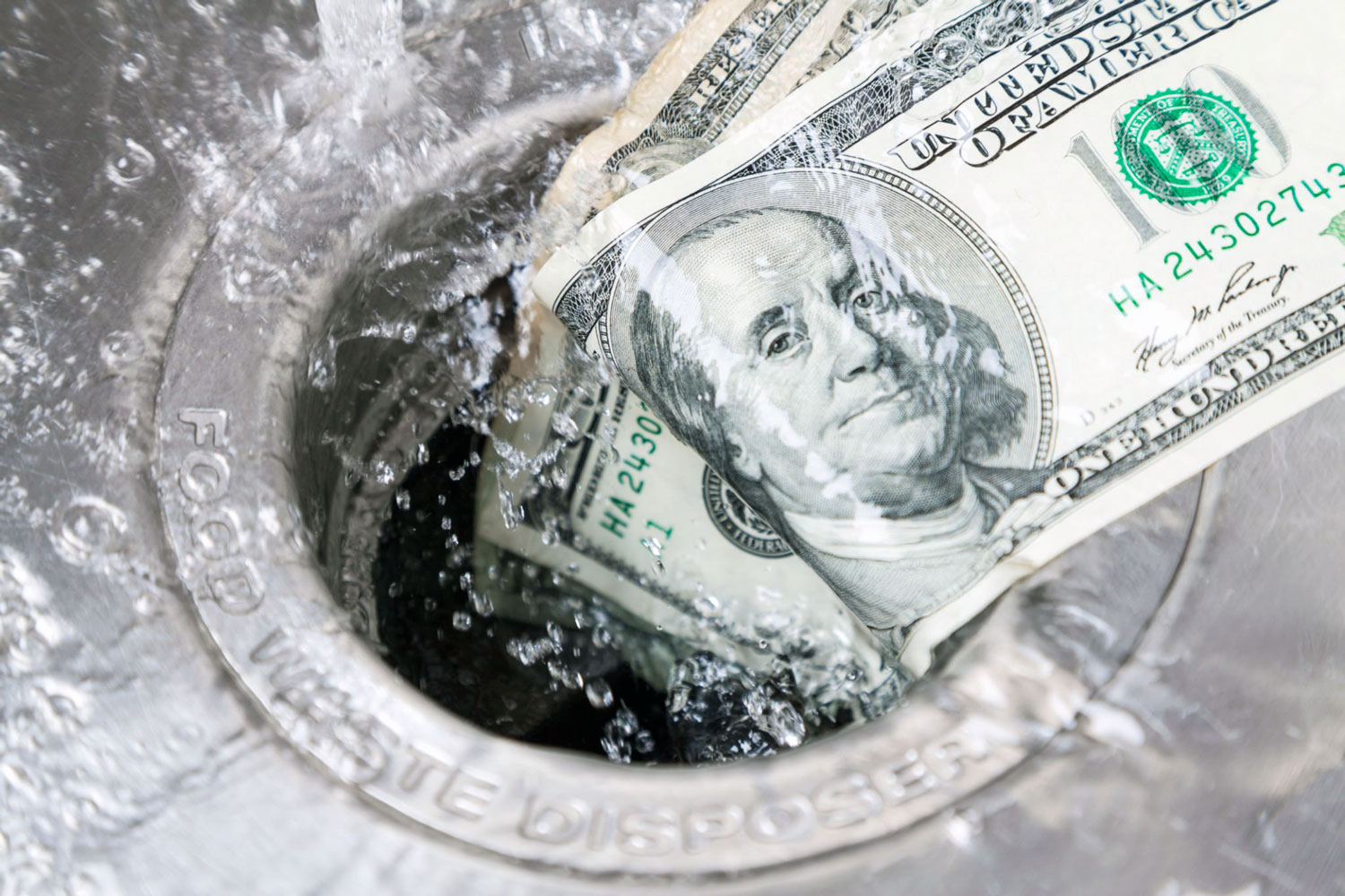 money-going-down-drain